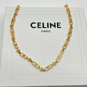 Authentic CELINE gold metal charm necklace with original box